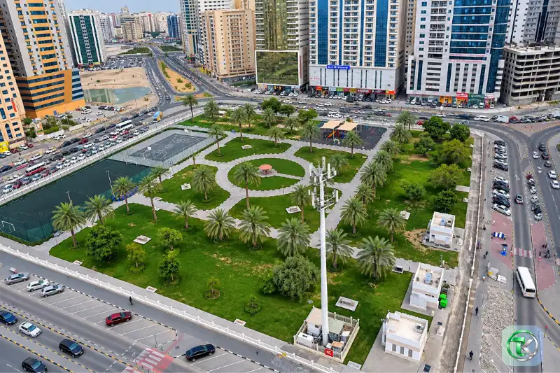 Aerial view of Al Nahda Park Sharjah with sports courts and green spaces