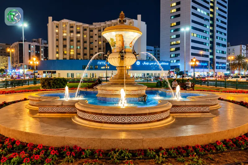 Illuminated fountain at Al Zahra Square near Clock Tower Sharjah at night