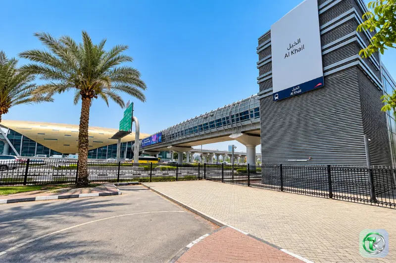 Al Khail Metro Station entrance and elevated Dubai Metro track on Sheikh Zayed Road