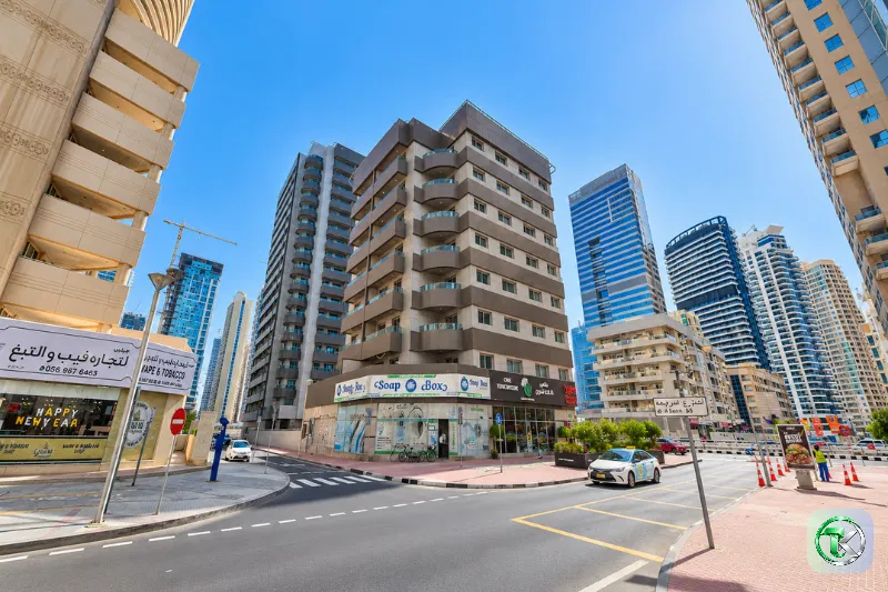 Al Zarooni Building Marina with nearby shops and surrounding high-rise towers