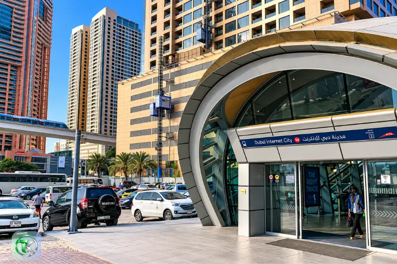 Dubai Internet City Metro Station entrance with nearby skyscrapers and road access