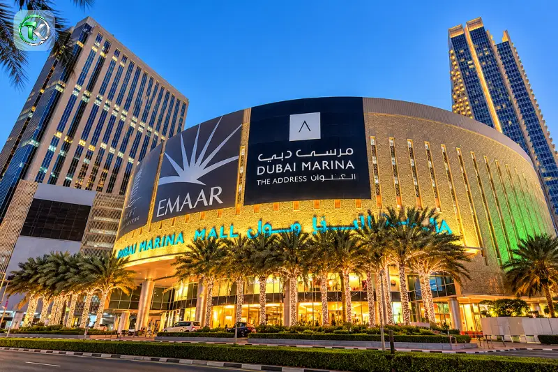 Dubai Marina Mall exterior with illuminated façade and surrounding towers