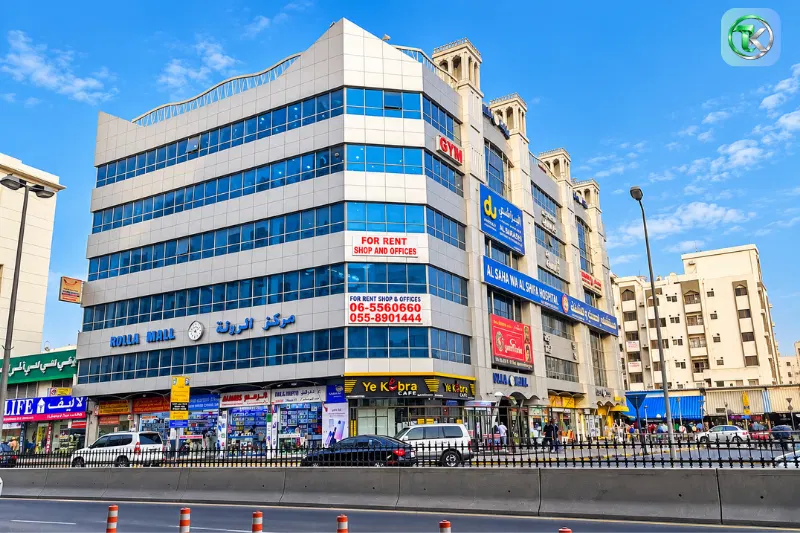 Rolla Mall Sharjah building exterior with shops and offices along Al Arouba Street